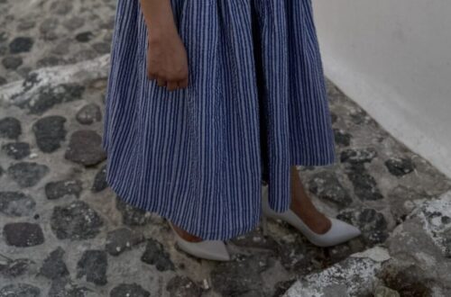 Blue stripy sundress with ivory heels.
